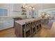 Modern kitchen with a large island and breakfast bar open to the dining and living areas at 81 Delmont Ne Dr, Atlanta, GA 30305
