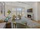 Sunlit living room with a fireplace, coffered ceilings, and large windows offering great natural light at 81 Delmont Ne Dr, Atlanta, GA 30305