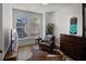 Cozy living room featuring hardwood floors, a large window, and comfortable seating at 81 Delmont Ne Dr, Atlanta, GA 30305