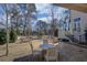Outdoor patio with gravel, surrounded by green trees and complete with seating at 81 Delmont Ne Dr, Atlanta, GA 30305