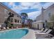 Community pool featuring lounge chairs and well-maintained landscaping, ideal for outdoor enjoyment at 81 Delmont Ne Dr, Atlanta, GA 30305