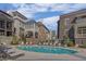 Community pool surrounded by lounge chairs and upscale townhomes, perfect for relaxation at 81 Delmont Ne Dr, Atlanta, GA 30305
