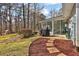 View of the patio, grill, and beautifully landscaped backyard with mature trees at 2113 N Landing Way, Marietta, GA 30066