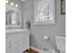 Bright bathroom with a clean vanity, mirror, and ample natural light from the window at 2113 N Landing Way, Marietta, GA 30066