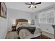 Cozy bedroom featuring neutral tones, a ceiling fan, and a patterned rug for a relaxing retreat at 2113 N Landing Way, Marietta, GA 30066