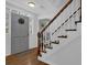 Foyer with gray door, white trim, wood flooring, and staircase with white railings at 2113 N Landing Way, Marietta, GA 30066