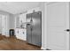 Kitchen area features stainless steel refrigerator, white cabinets, and granite countertops at 2113 N Landing Way, Marietta, GA 30066