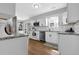 Modern kitchen featuring white cabinets, stainless steel appliances, and granite countertops at 2113 N Landing Way, Marietta, GA 30066