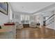 Living room featuring hardwood floors, seating, and a staircase at 2113 N Landing Way, Marietta, GA 30066