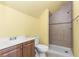 Bathroom featuring a tile shower and updated sink at 2201 Chase Se Way, Conyers, GA 30013