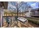 Cozy balcony with outdoor seating provides a relaxing space overlooking lush greenery at 30 Finch Ne Trl, Atlanta, GA 30308