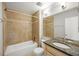 Bathroom featuring granite countertop, tile flooring and shower-tub combination at 30 Finch Ne Trl, Atlanta, GA 30308