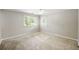 Sunlit bedroom with neutral carpet, ceiling fan, and double windows at 30 Finch Ne Trl, Atlanta, GA 30308