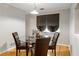 Cozy dining area with a glass table, four chairs, and natural light from a window at 30 Finch Ne Trl, Atlanta, GA 30308