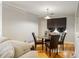 Cozy dining area with a glass table, four chairs, and natural light from a window at 30 Finch Ne Trl, Atlanta, GA 30308