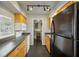 Modern kitchen with stainless steel appliances, wood cabinets, and a view of the dining area at 30 Finch Ne Trl, Atlanta, GA 30308