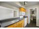 Bright kitchen featuring wood cabinets, sleek countertops, and modern white appliances at 30 Finch Ne Trl, Atlanta, GA 30308