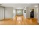 Open living space with hardwood floors, dining area, and a glimpse into the modern kitchen at 30 Finch Ne Trl, Atlanta, GA 30308