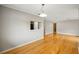 Spacious living room with hardwood floors and view into the kitchen; neutral and modern space at 30 Finch Ne Trl, Atlanta, GA 30308