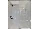 Stylish bathroom featuring a glass-enclosed shower with modern fixtures and marble tiling at 383 Oakridge Se Dr, Cartersville, GA 30121