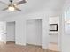 Bright bedroom featuring hardwood floors, two closets, and a vanity area creating ample storage and space at 383 Oakridge Se Dr, Cartersville, GA 30121