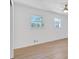 Bright bedroom featuring two windows and a ceiling fan with light, creating a refreshing atmosphere at 383 Oakridge Se Dr, Cartersville, GA 30121