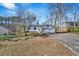 Single story house with a freshly painted exterior, featuring an attached garage and an expansive front lawn at 383 Oakridge Se Dr, Cartersville, GA 30121