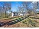 Charming renovated home with a new roof and inviting exterior, nestled on a spacious lawn at 383 Oakridge Se Dr, Cartersville, GA 30121