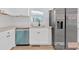 View of the kitchen area with modern appliances, including a stainless steel refrigerator and dishwasher at 383 Oakridge Se Dr, Cartersville, GA 30121