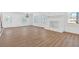Bright living room with beautiful wood floors, fresh white paint and filled with natural light from multiple windows at 383 Oakridge Se Dr, Cartersville, GA 30121