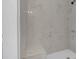 A shower featuring white marble wall tiles with light contrasting veins at 383 Oakridge Se Dr, Cartersville, GA 30121