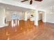 Open-concept living area with hardwood floors, white columns and a fireplace at 45 Fiddle Crk, Social Circle, GA 30025