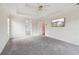 Spacious main bedroom featuring a tray ceiling, recessed lighting and a large flat screen TV at 918 Edgewater Dr, Loganville, GA 30052