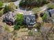Aerial view of an elegant home with a well-maintained yard and private outdoor living spaces at 102 Stargaze Rdg, Canton, GA 30114