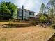 Beautiful backyard with a deck, hot tub, playset, and plenty of room to enjoy the outdoors at 102 Stargaze Rdg, Canton, GA 30114