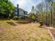 Large backyard with a deck, hot tub, playset, and plenty of space for outdoor activities at 102 Stargaze Rdg, Canton, GA 30114