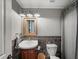 Charming bathroom with mosaic tile backsplash, pedestal sink, and classic fixtures at 102 Stargaze Rdg, Canton, GA 30114