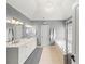 Spacious primary bathroom with double sinks, tub, and modern vanity lighting beneath a vaulted ceiling at 102 Stargaze Rdg, Canton, GA 30114