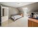 Comfortable bedroom with neutral tones, dormer windows and carpet floors at 102 Stargaze Rdg, Canton, GA 30114