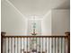 Foyer featuring grand entry chandelier, detailed iron railings, with a view of the front door at 102 Stargaze Rdg, Canton, GA 30114