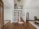 Bright foyer featuring hardwood floors, a staircase with railings, and views into other rooms at 102 Stargaze Rdg, Canton, GA 30114