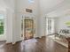 Bright foyer with hardwood floors, soaring ceilings, transom windows, and a beautiful front door at 102 Stargaze Rdg, Canton, GA 30114