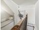 Second floor hallway with iron banisters, window nook with seating and decorative pictures at 102 Stargaze Rdg, Canton, GA 30114