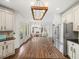 Gourmet kitchen with large island and stainless steel refrigerator at 102 Stargaze Rdg, Canton, GA 30114