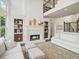 Comfortable living area includes built-ins, fireplace, and plush seating at 102 Stargaze Rdg, Canton, GA 30114