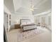 Primary bedroom featuring tray ceiling, ceiling fan, plush rug, and abundant natural light at 102 Stargaze Rdg, Canton, GA 30114