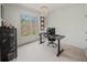 Bright office space with a large window and a black desk and chair for a comfortable work environment at 102 Stargaze Rdg, Canton, GA 30114
