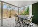 Cozy covered patio with elegant furniture, perfect for outdoor dining and relaxation at 102 Stargaze Rdg, Canton, GA 30114