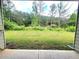 Picture of a large backyard with green grass and lots of trees at 1125 Campbell Pine Trl, Lawrenceville, GA 30045