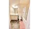 View of the bathroom with cream cabinets, a white toilet and a shower with a tub at 1125 Campbell Pine Trl, Lawrenceville, GA 30045